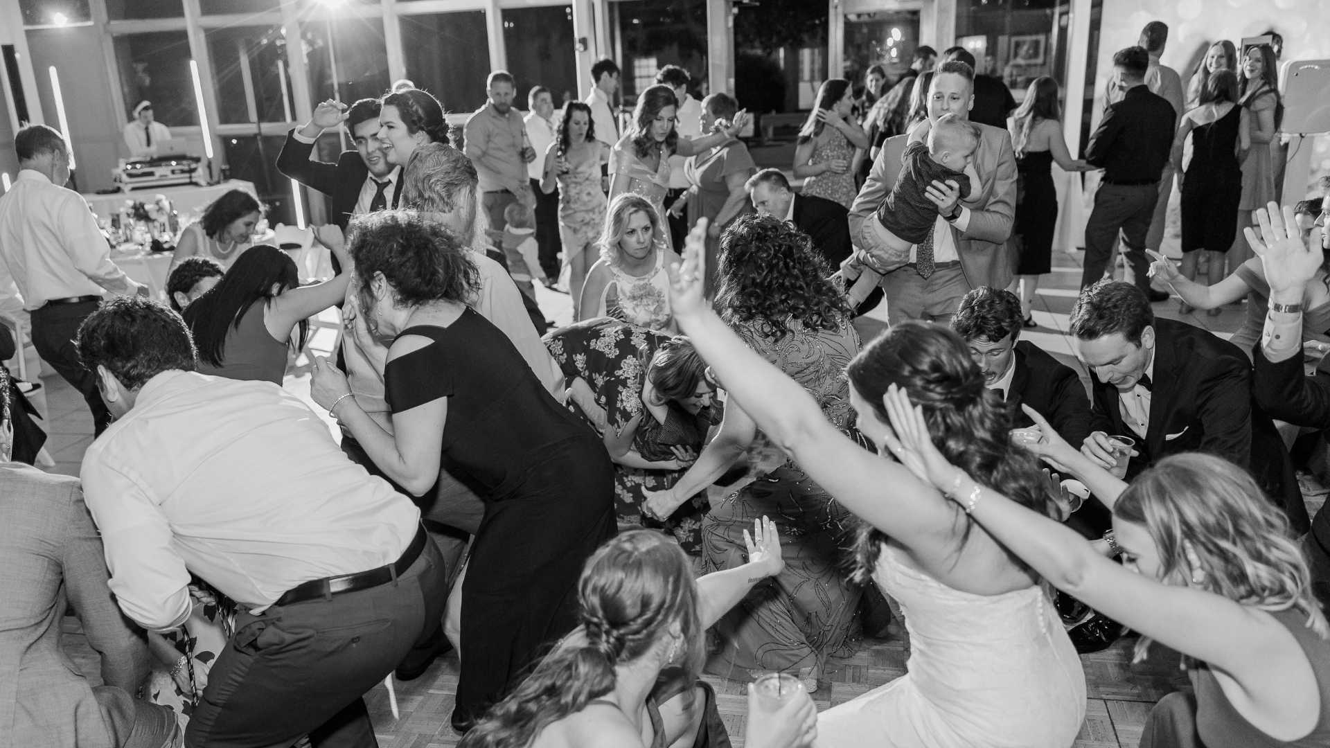 Chicago wedding DJ blog featuring packed dance floor, elegant reception lighting, and professional DJ performance