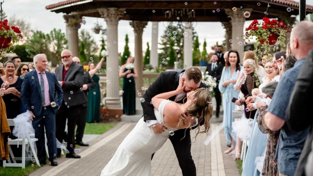 Chicago wedding DJ Nick Vera setting up a separate sound system for a wedding ceremony at an outdoor Chicagoland venue