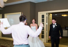 Wedding DJ Nick Vera coordinating with vendors at a Chicago reception — Impulse Entertainment